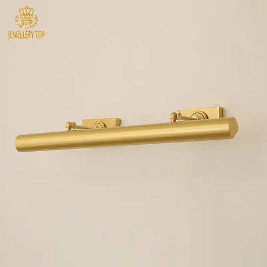 Vintage brass wall sconce with spherical accents