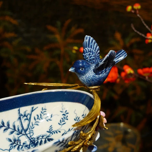 Full view of decorative ceramic tray with brass edges and bird figurines