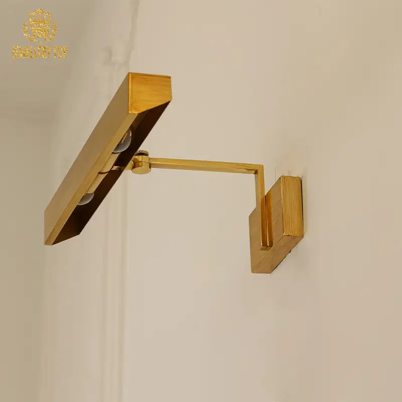 Close-up of brass wall sconce’s LED glow