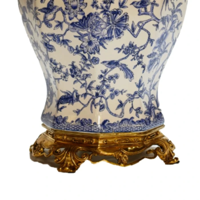 Top-down view focusing on the jar's brass pomegranate finial and dome lid with classical motifs.