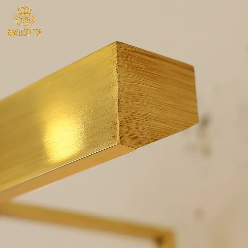 Close-up of brass wall sconce’s LED glow