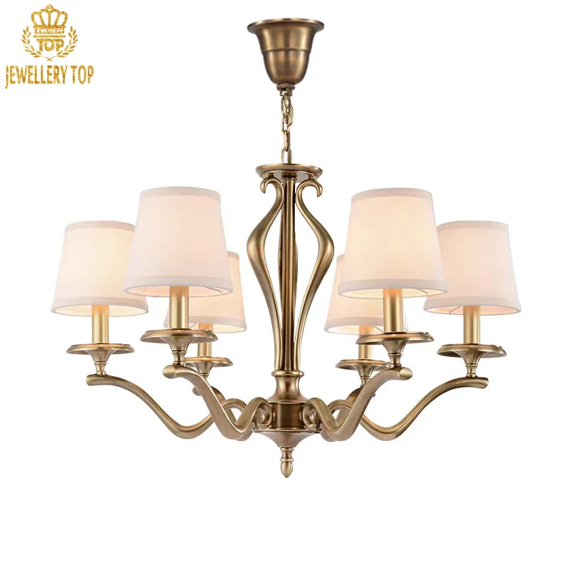 Rustic brass pendant light with white shades and scrollwork details