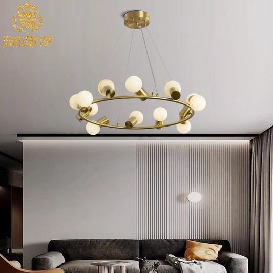 Brass ring chandelier with organic alabaster orbs in a contemporary living room setting