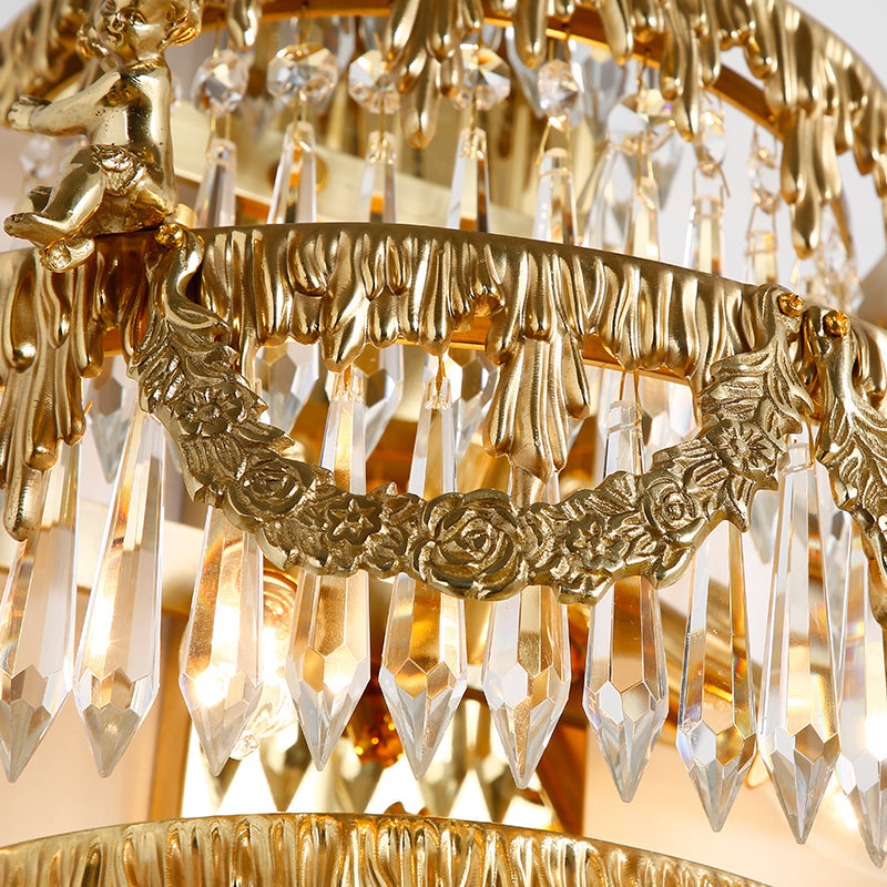 Close-up of pineapple-inspired metal leaves at the top of the wall sconce