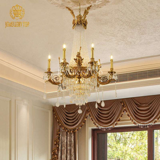 Close-up of Baroque acanthus leaf brass arms and Edison bulbs in a grand lobby