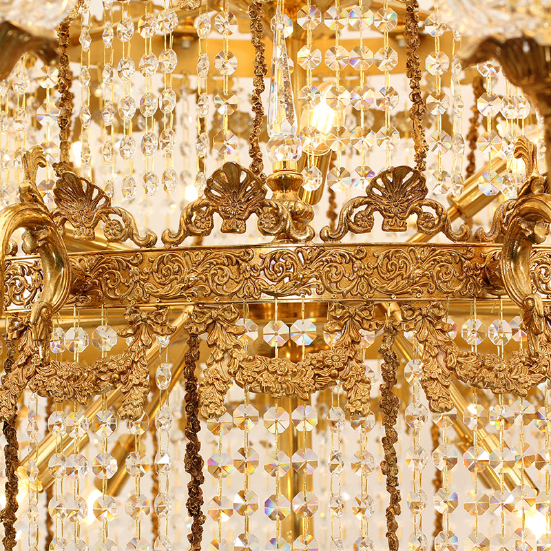 Close-up of Apollo’s Radiance chandelier with cascading crystals and ornate brass frame