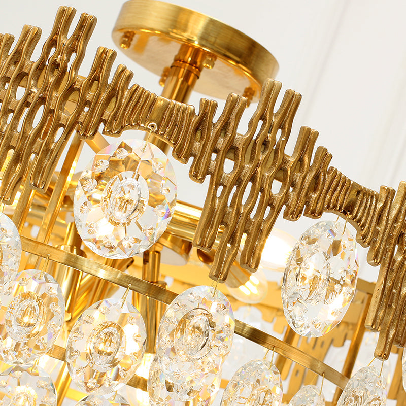 Close-up detail of brass textures resembling ocean coral with crystal accents.