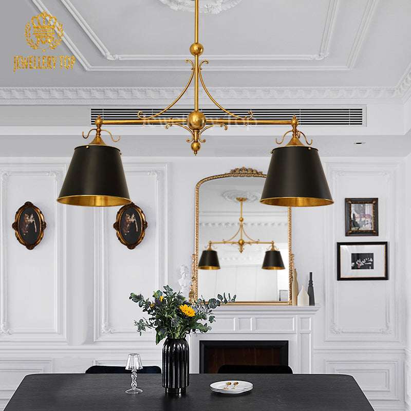Hand-polished brass framework casting intricate shadows on a marble dining table