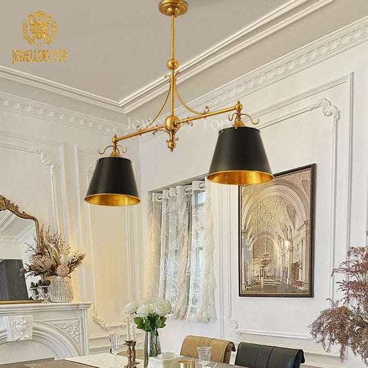 Roman-inspired scrollwork and central orb on Art Deco brass pendant light