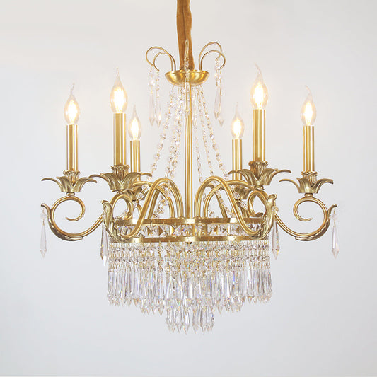 Brass chandelier with cascading crystal droplets in antique gold finish