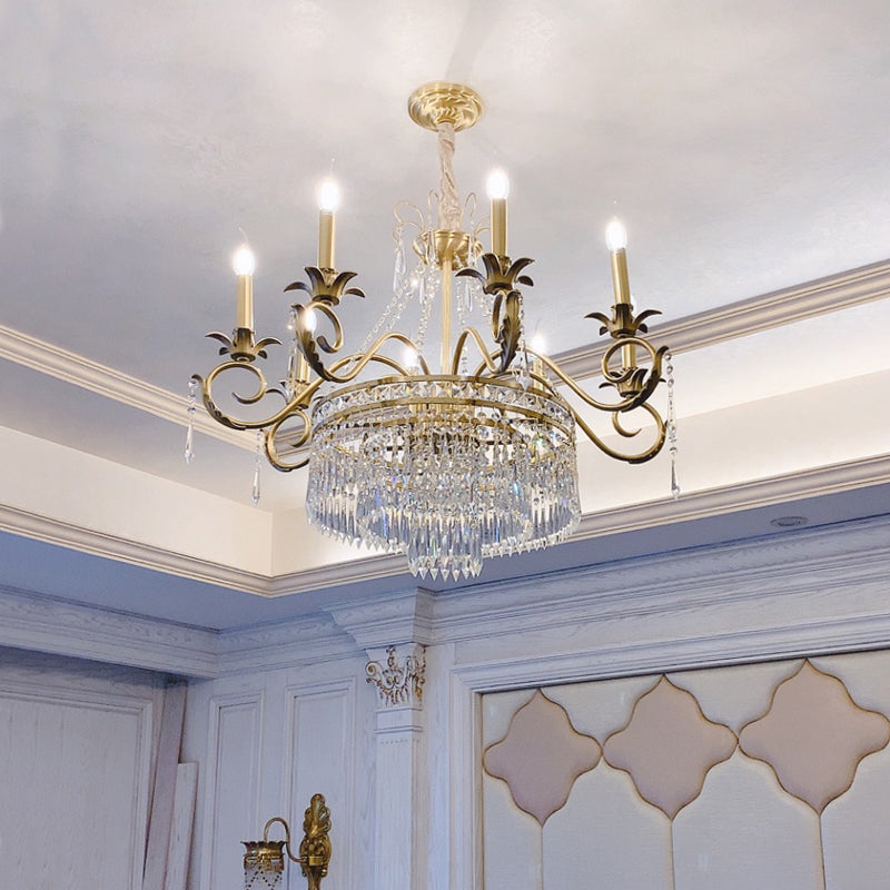 Nine‑arm empire crystal chandelier illuminating elegant foyer