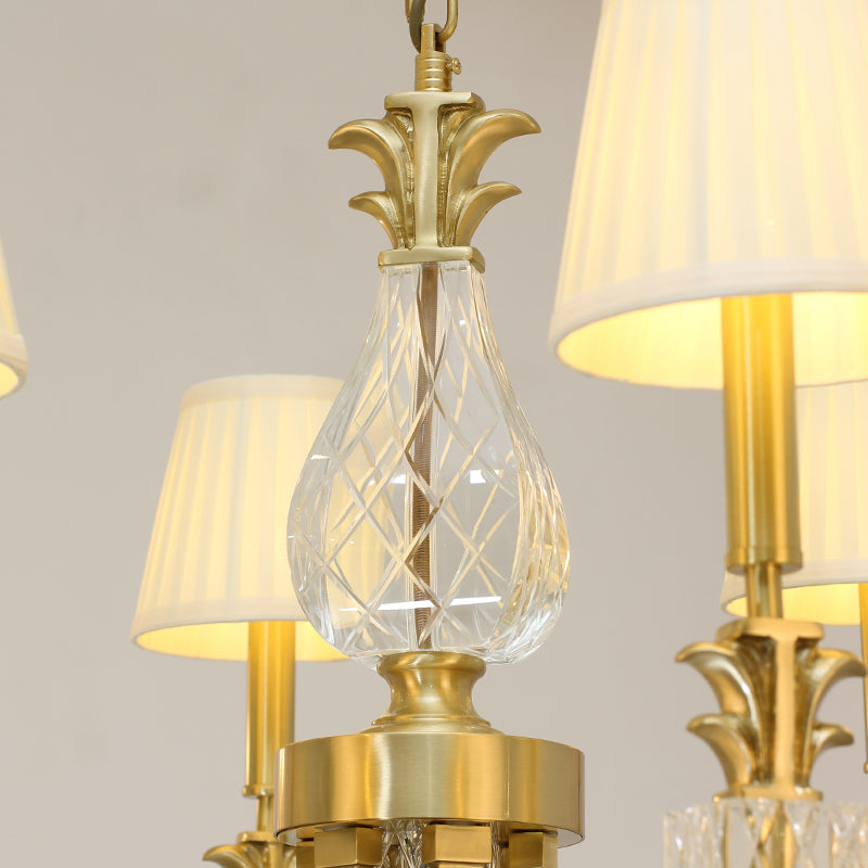 Detailed brass and glass features on the gold chandelier