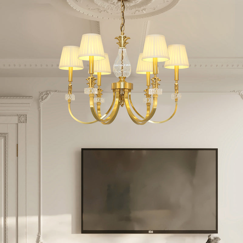 Illuminated Auric Halo gold chandelier highlighting refined craftsmanship