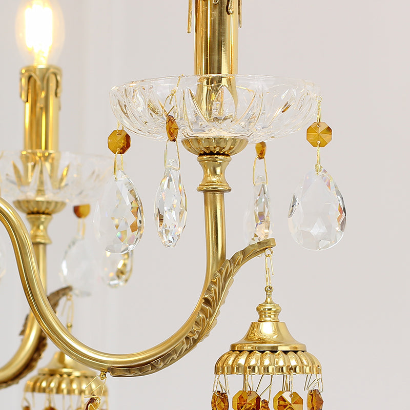Close-up showcasing ornate brass arms and amber-hued crystal accents