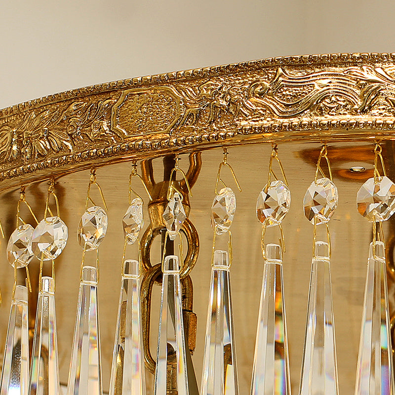 Close-up of ornate brass detailing featuring Greco-Roman floral motifs and crystal accents.