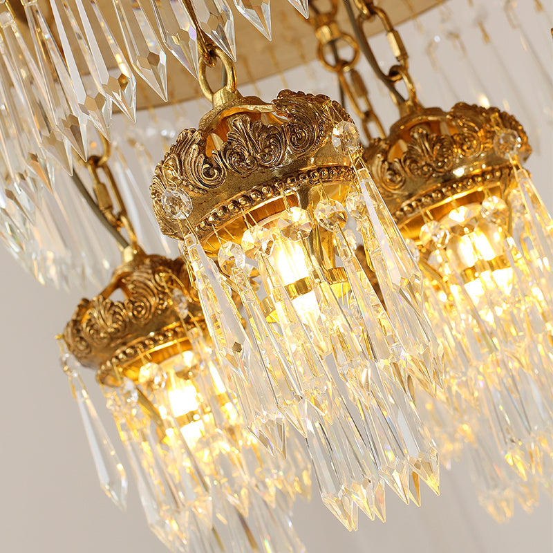 Cassiopeia-themed crystal ceiling lamp showcasing luminous brass crowns and hanging crystals.