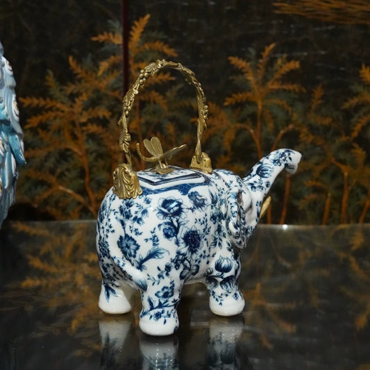 Elephant teapot decorative ornament featuring floral patterns and golden dragonfly detail