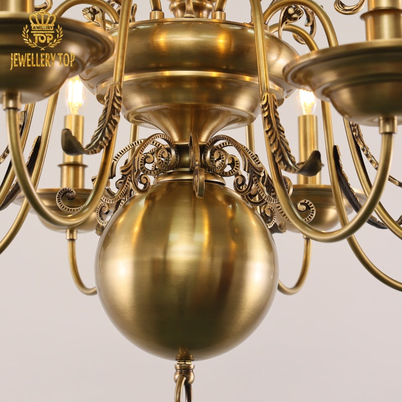 Celestial-inspired brass chandelier with fluted drip pans and warm glow