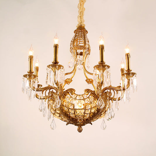 Close-up of ornate brass detailing on a vintage chandelier