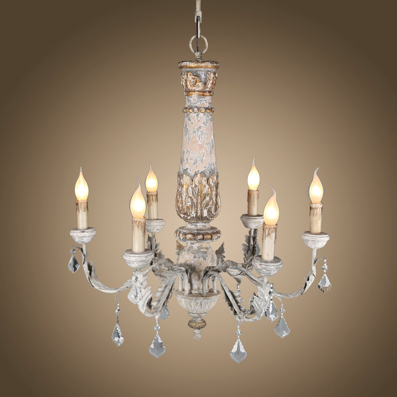 Vintage Edison bulbs casting warm glow over crystal dewdrop details