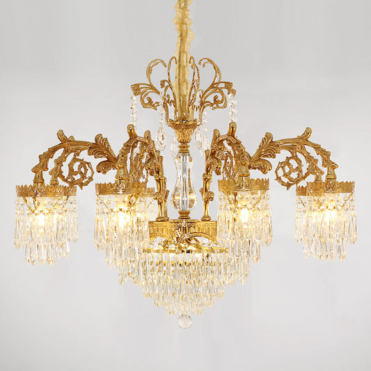 Elegant brass arms and crystal pendants of a vintage French chandelier