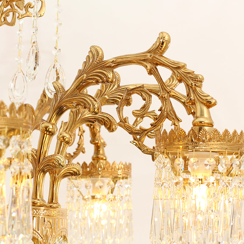 Ornate Rococo design featuring flowing brass curves and shimmering crystals