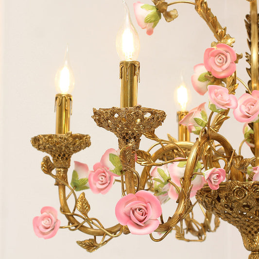 Close-up of brass and ceramic details on the vintage french chandelier