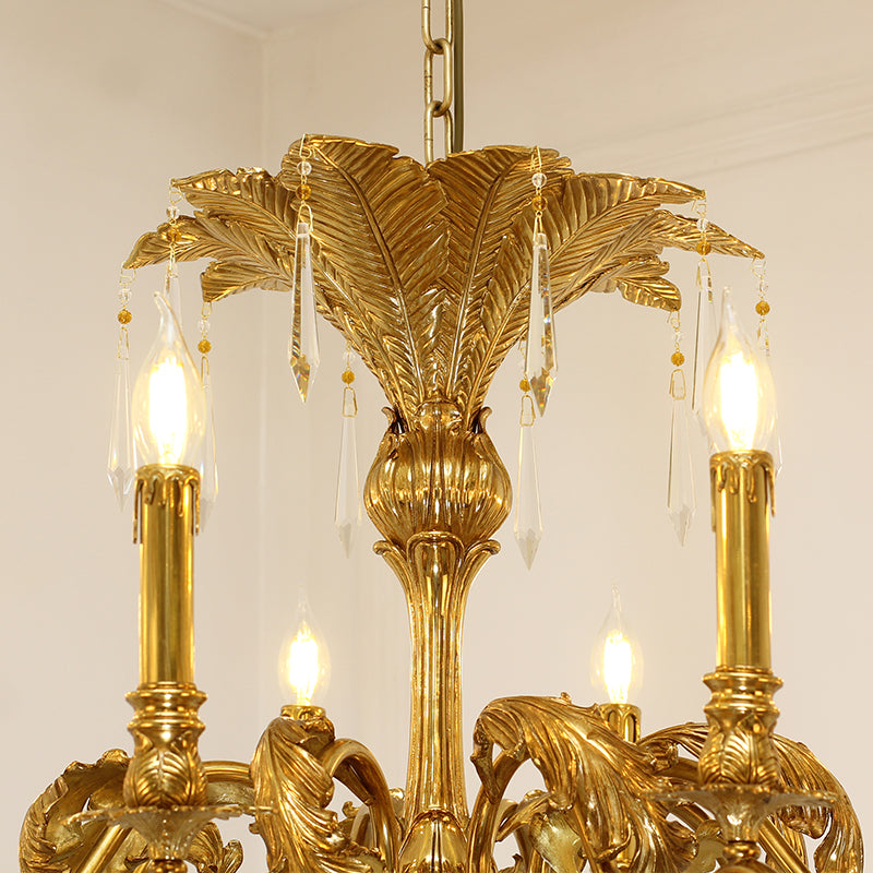 Close-up of handcrafted brass palm leaves and detailed vintage-style candle holders.