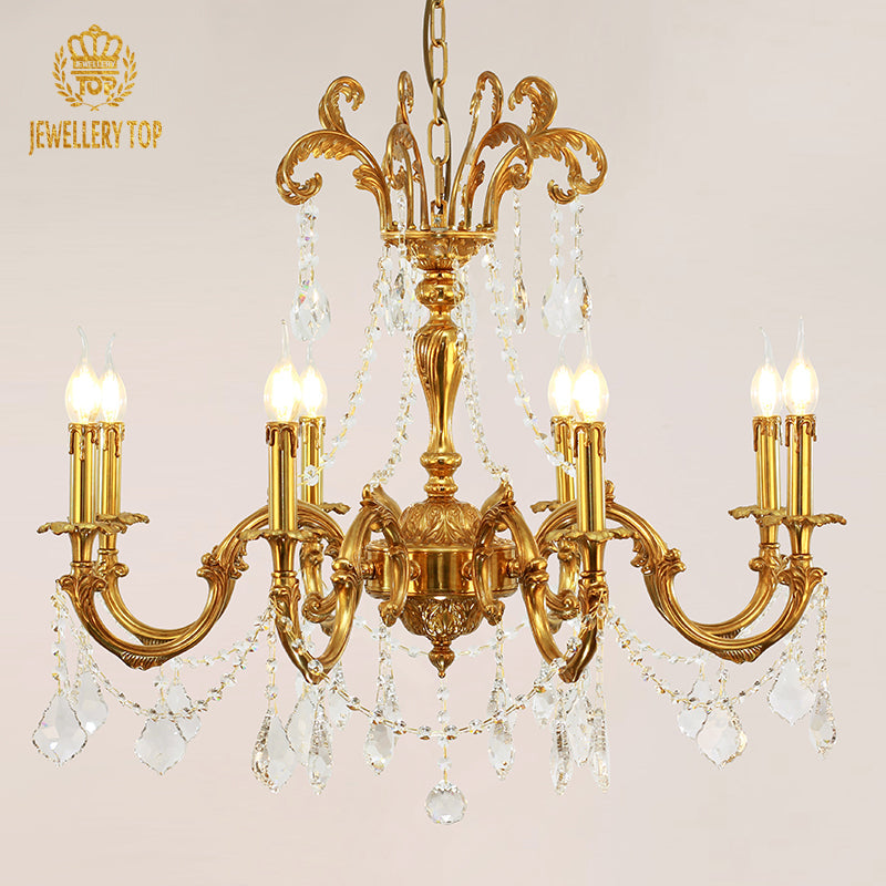 Vintage bronze chandelier with curved arms and sparkling crystal droplets.