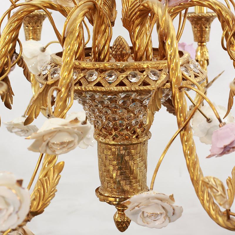 Crystal and brass components of the Eternelle Fleur chandelier