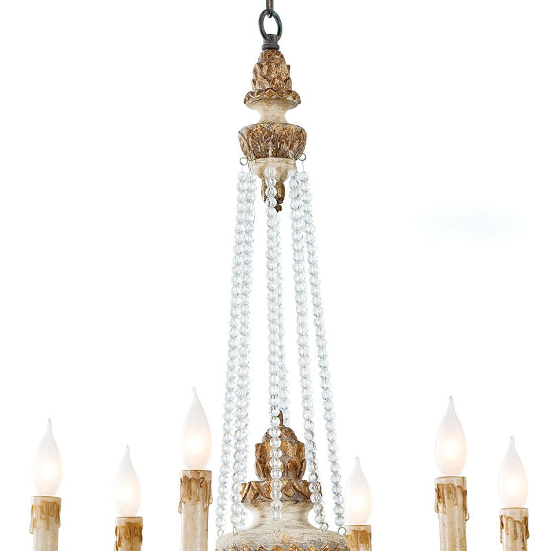 Close-up of frosted candle-style bulbs and crystal chains on farmhouse ceiling fixture