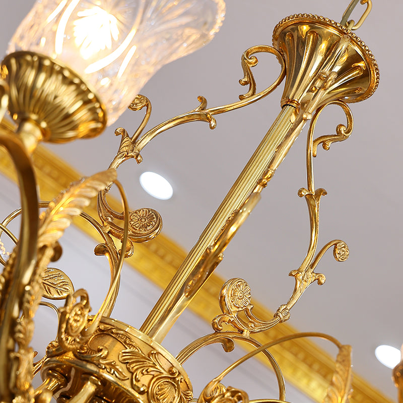 legant floral-inspired glass shades glowing softly on vintage gold chandelier.