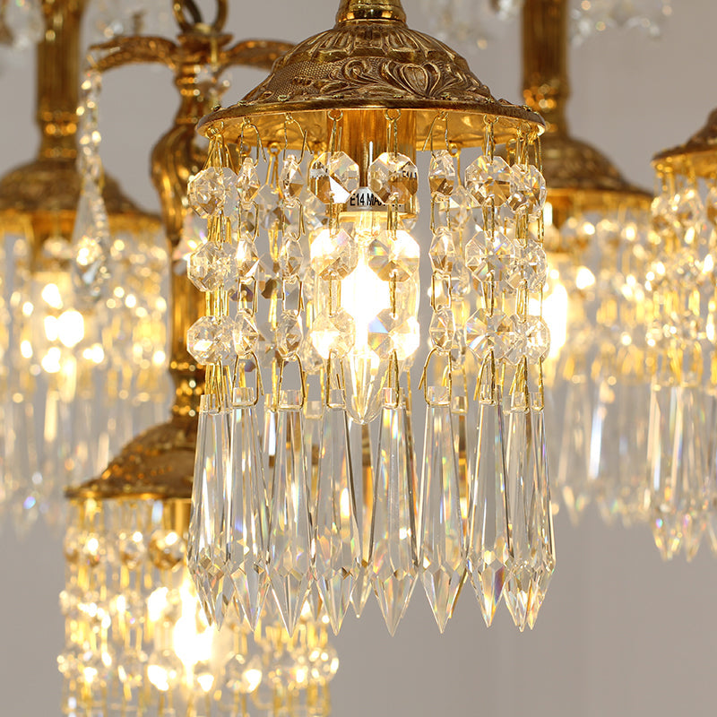Detailed view of brass and crystal elements of vintage chandelier
