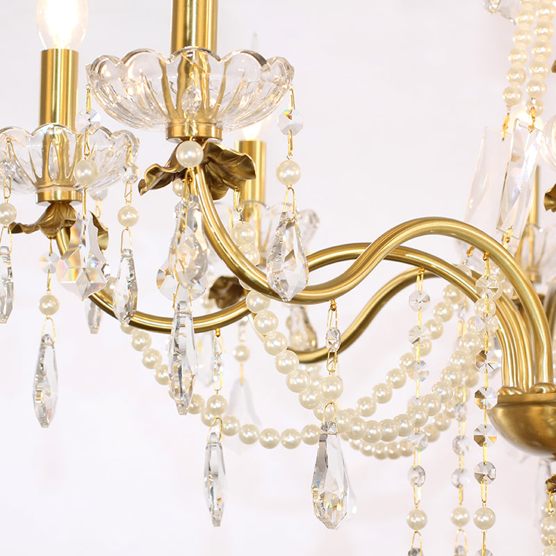 Decorative bobeches reflecting the chandelier’s warm, inviting glow.