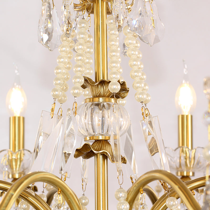 Close-up of pearl-like strands intertwined with crystal accents on a luxury lighting fixture.