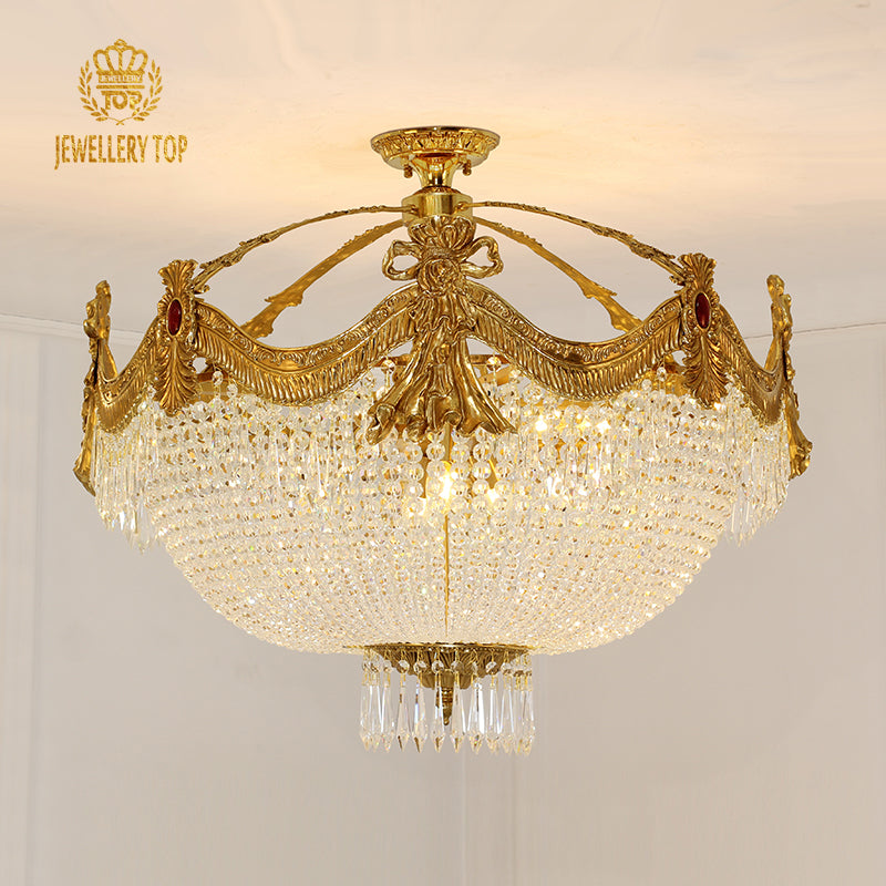 Renaissance-style vintage ceiling light with ornate brass garland frame and crystal detailing.