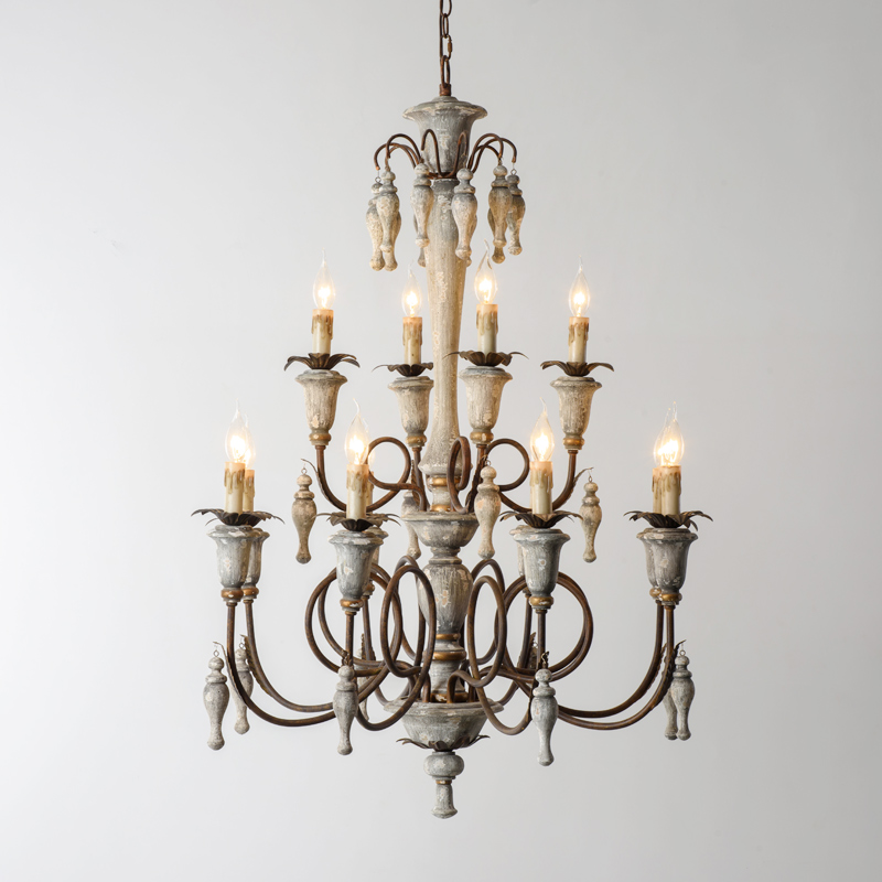 Antique pewter patina and linen shades casting warm light over a farmhouse table