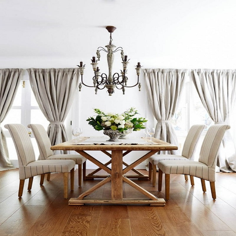 Hand-forged iron branches and wooden acorn pendants on pastoral ceiling fixture
