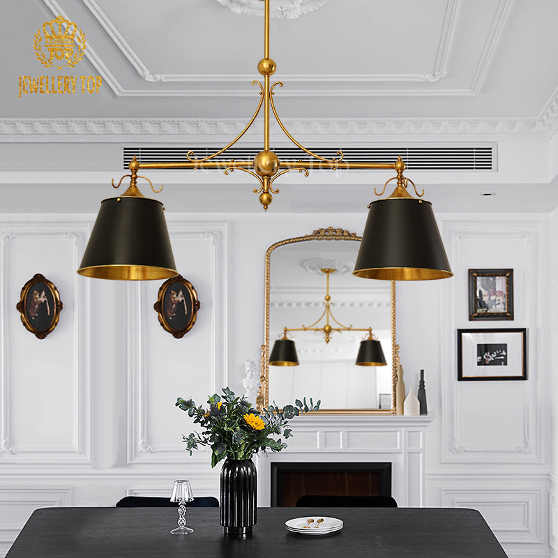 Hand-polished brass framework casting intricate shadows on a marble dining table