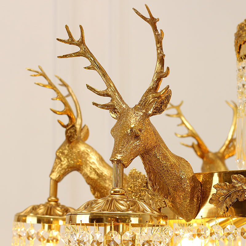 Baroque-inspired chandelier with intricate brass antler accents and crystal beads