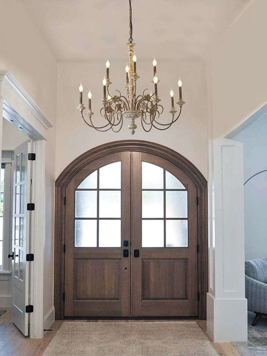 Close-up of Provençal grapevine carvings on distressed oak chandelier hub