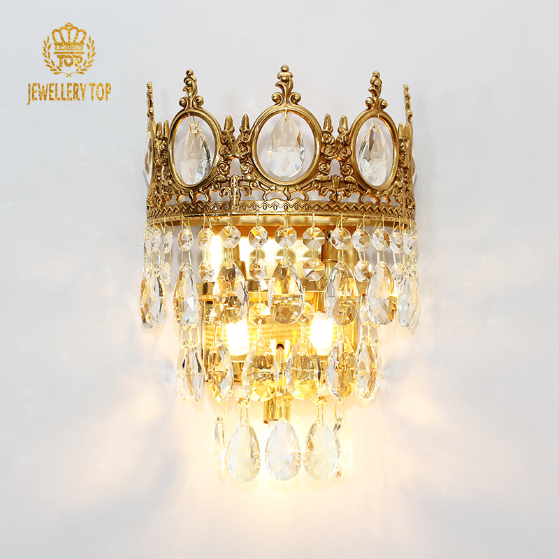 Frontal view of the Magnolia Crown Crystal Wall Sconce showing layered crystal drops