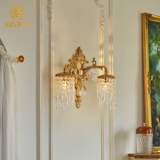 Side angle of the sconce, highlighting its Victorian-inspired scrollwork and luxury finish