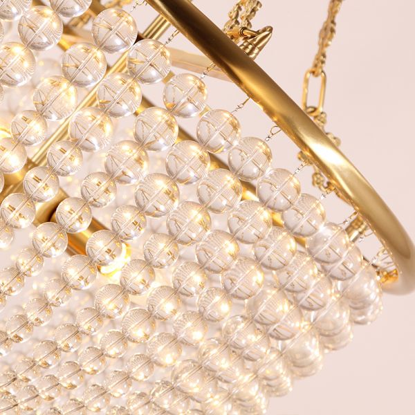 Close-up of brass and crystal details on Oceanic Serenity Coastal Pendant Lights