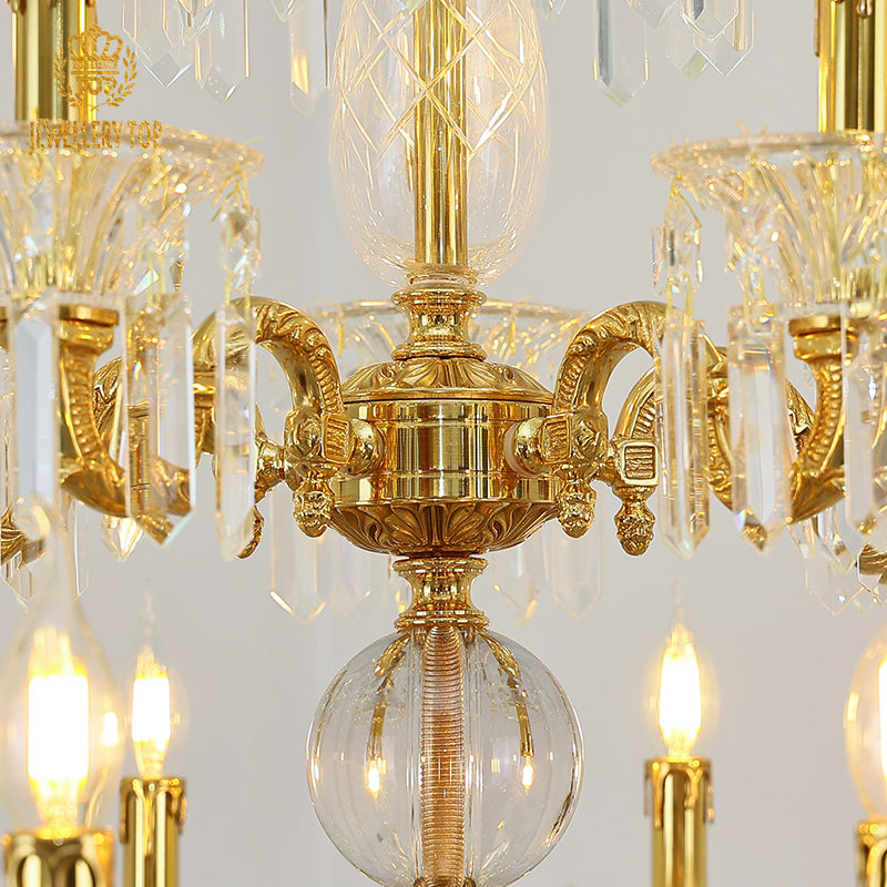 Elegant cascading crystal pendants and brass arms on a French chandelier