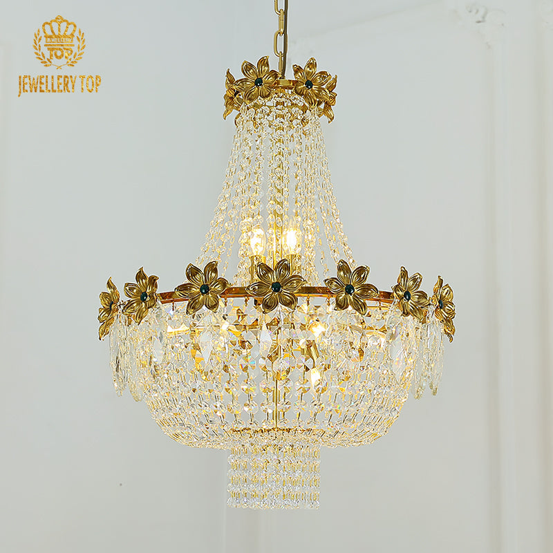 Ornate rococo chandelier with intricate brass and crystal detailing