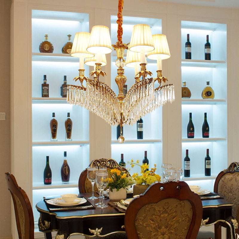 Fabric and crystal details enhancing the antique chandelier’s design