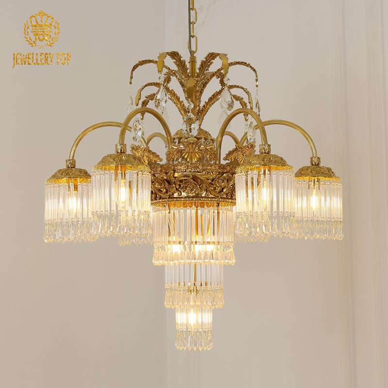 Ornate Victorian chandelier with brass arms and tropical palm motifs.
