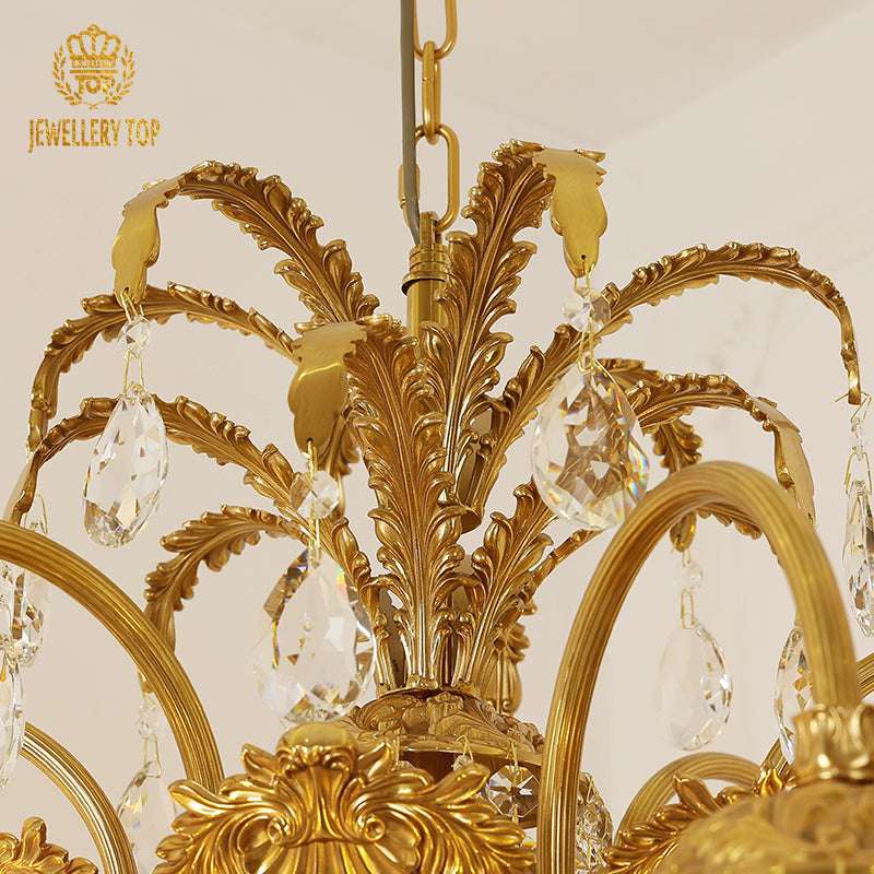 Delicate glass lantern shades suspended from palm-inspired brass detailing.