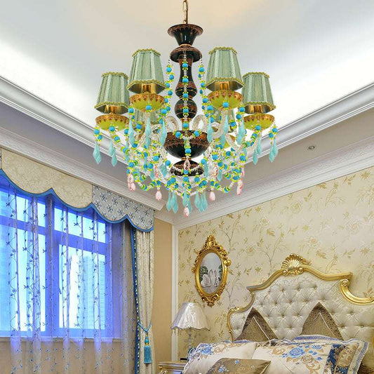 Pastoral Bloom chandelier showcasing eclectic, bohemian flair with bright beads and brass framework.